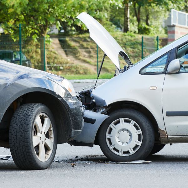 Car crash accident on street with wreck and damaged automobiles after collision