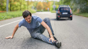 A person holding his leg